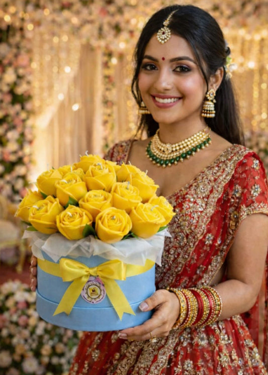 Woman in traditional attire holding a box of yellow roses against a decorated background