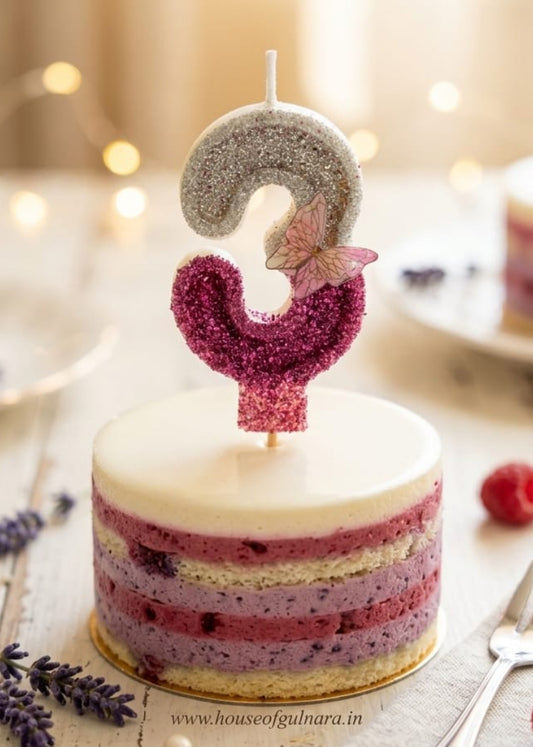 Small cake with a number 1 candle on a wooden table with a blurred background
