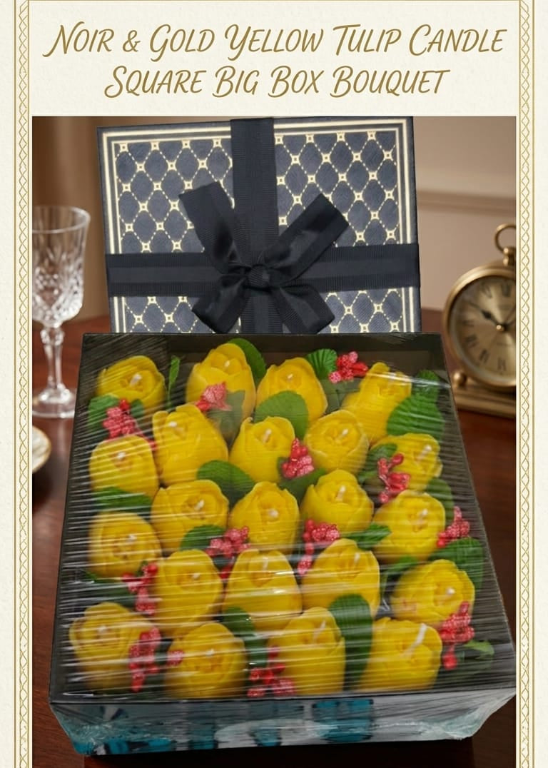 Square big box bouquet of yellow tulips with a black ribbon on a wooden surface.