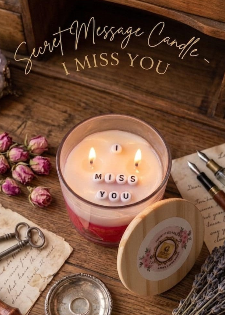 Candle with 'Miss You' message on a wooden surface with decorative items.